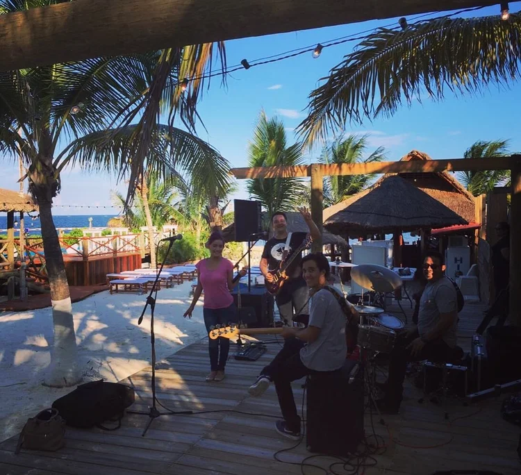 Guests relaxing at the Squalo Beach Club bar area